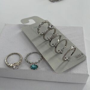 Assorted size 9 silver rings with new on card rings